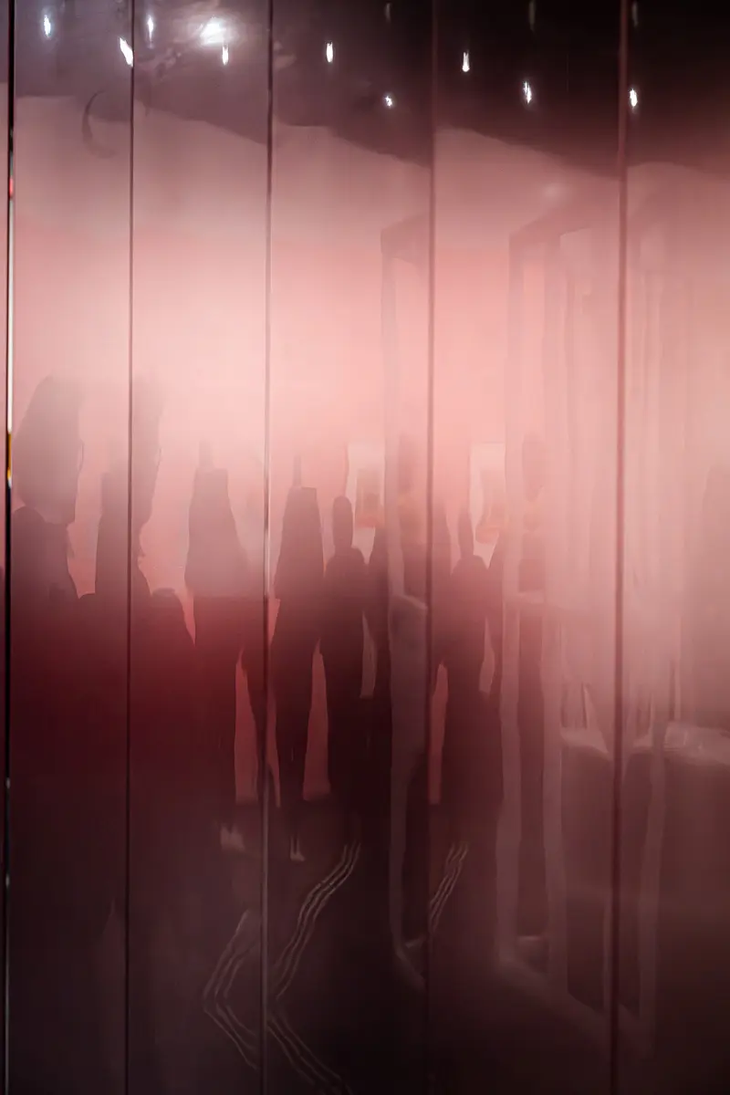 Blurred Silhouettes Behind Translucent Screen at Wien Museum Exhibition