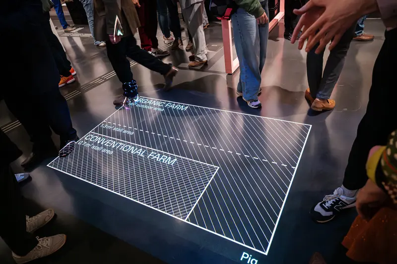 Interactive Floor Display with Geometric Grid During Exhibition Opening