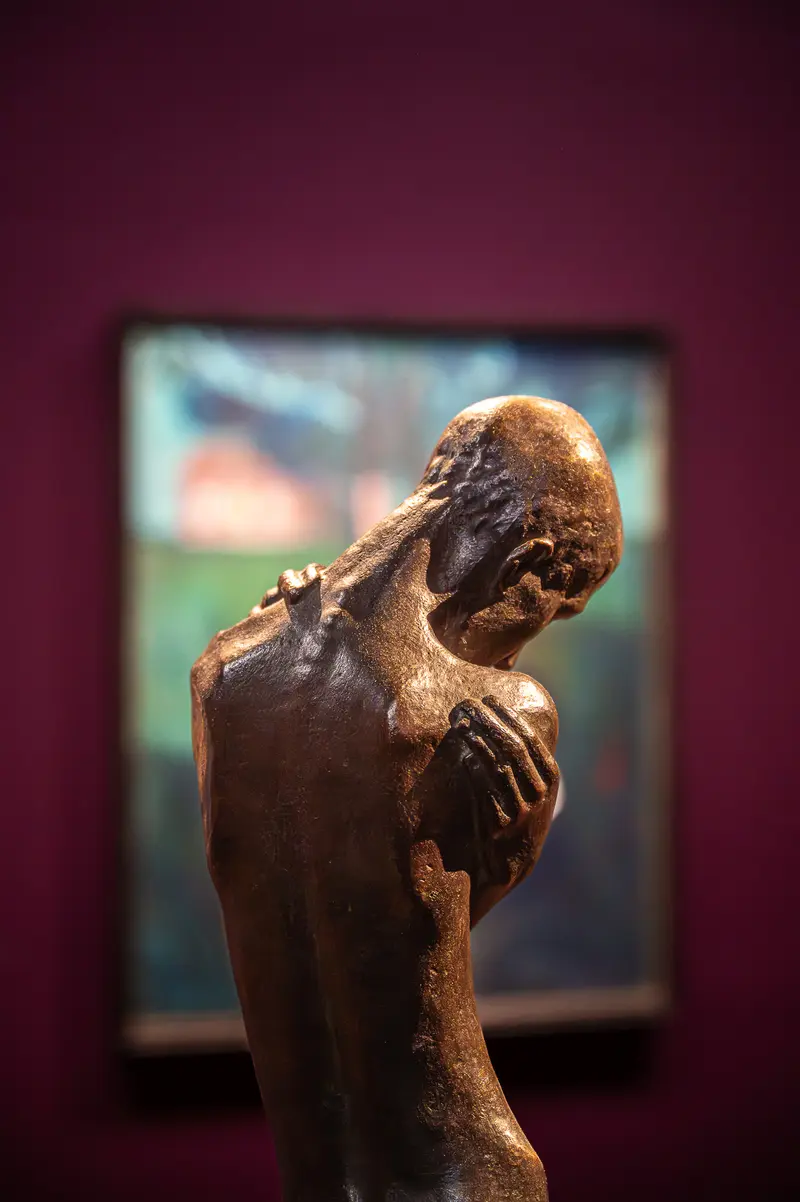 Weathered Bronze Sculpture Depicting Contemplative Human Figure at Gothic Modern Exhibition