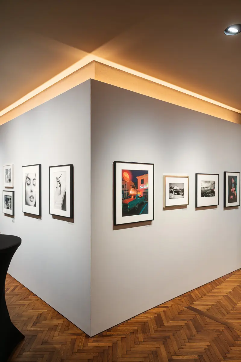 Art Gallery Interior with Framed Photographs and Modern Lighting Design