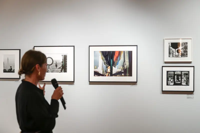 Art Gallery Visitor Examining Urban Photography Exhibit