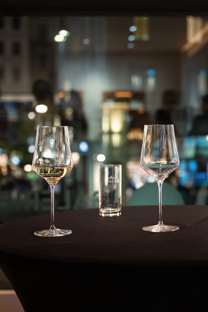 Wine Glasses on Black Table with Urban Nighttime Background