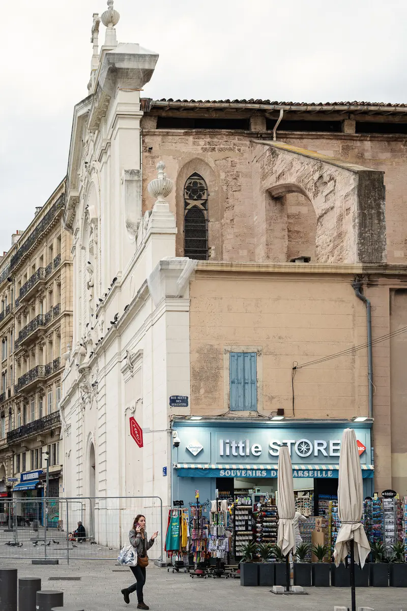 Little Store on Marseille Street with Historic Architecture and Storefront Display