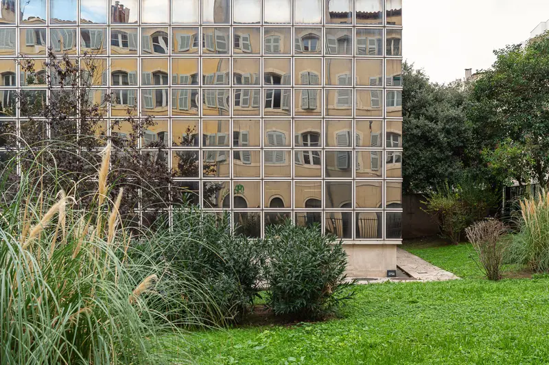 Marseille Modern Architecture: Reflective Glass Facade with Urban Landscape