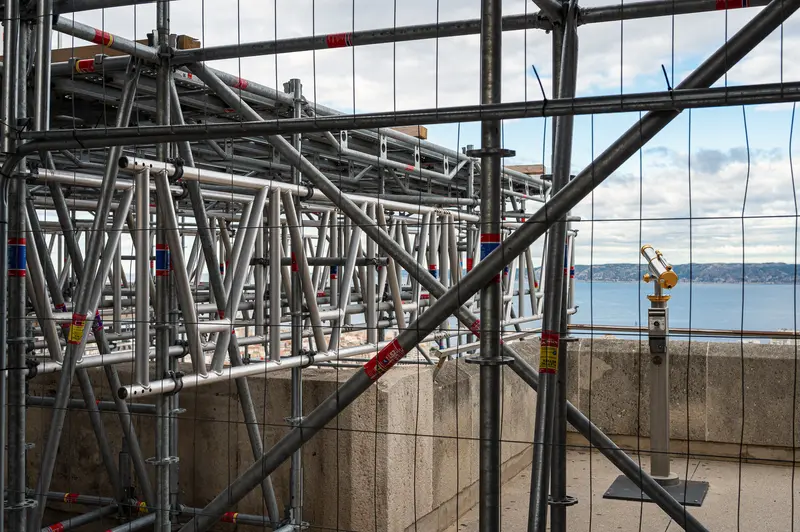 Complex Scaffolding Structure with Ocean View in Background