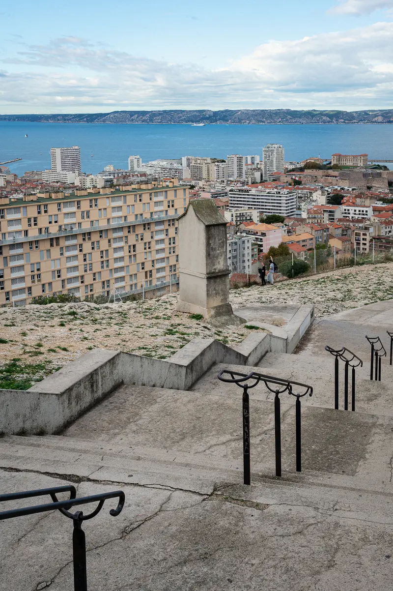 Marseille Urban Landscape: Concrete Stairs Overlooking Coastal Cityscape
