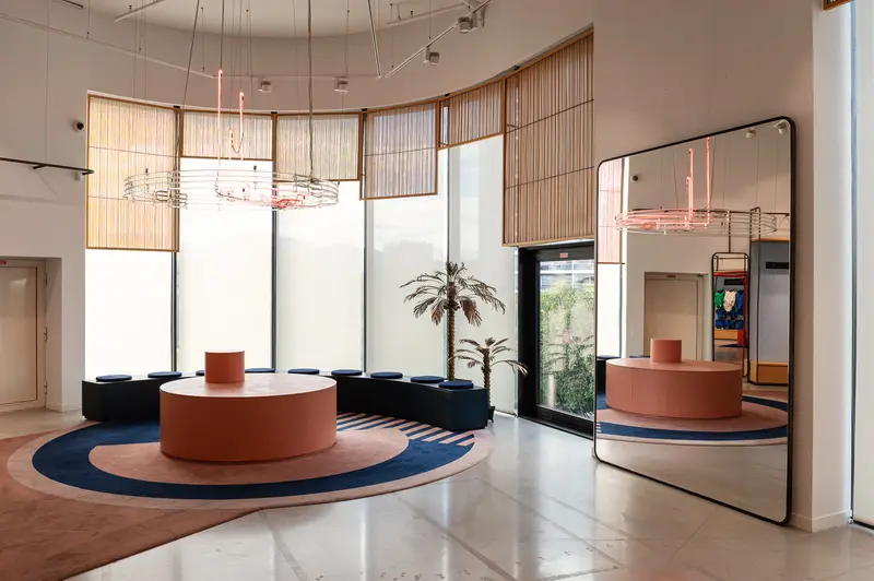 Modern Lobby with Circular Reception Desk and Minimalist Design Elements