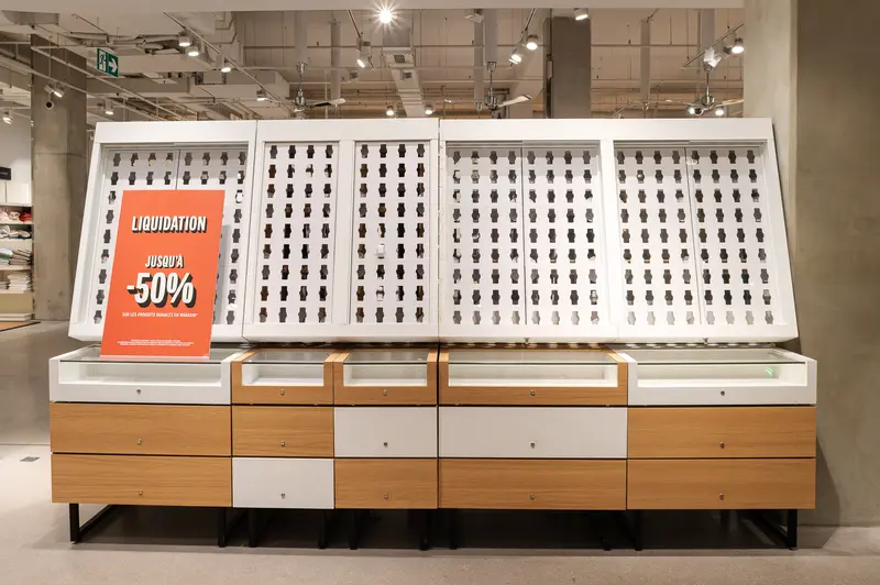 Retail Display with Liquidation Sale Signage in Modern Store Interior