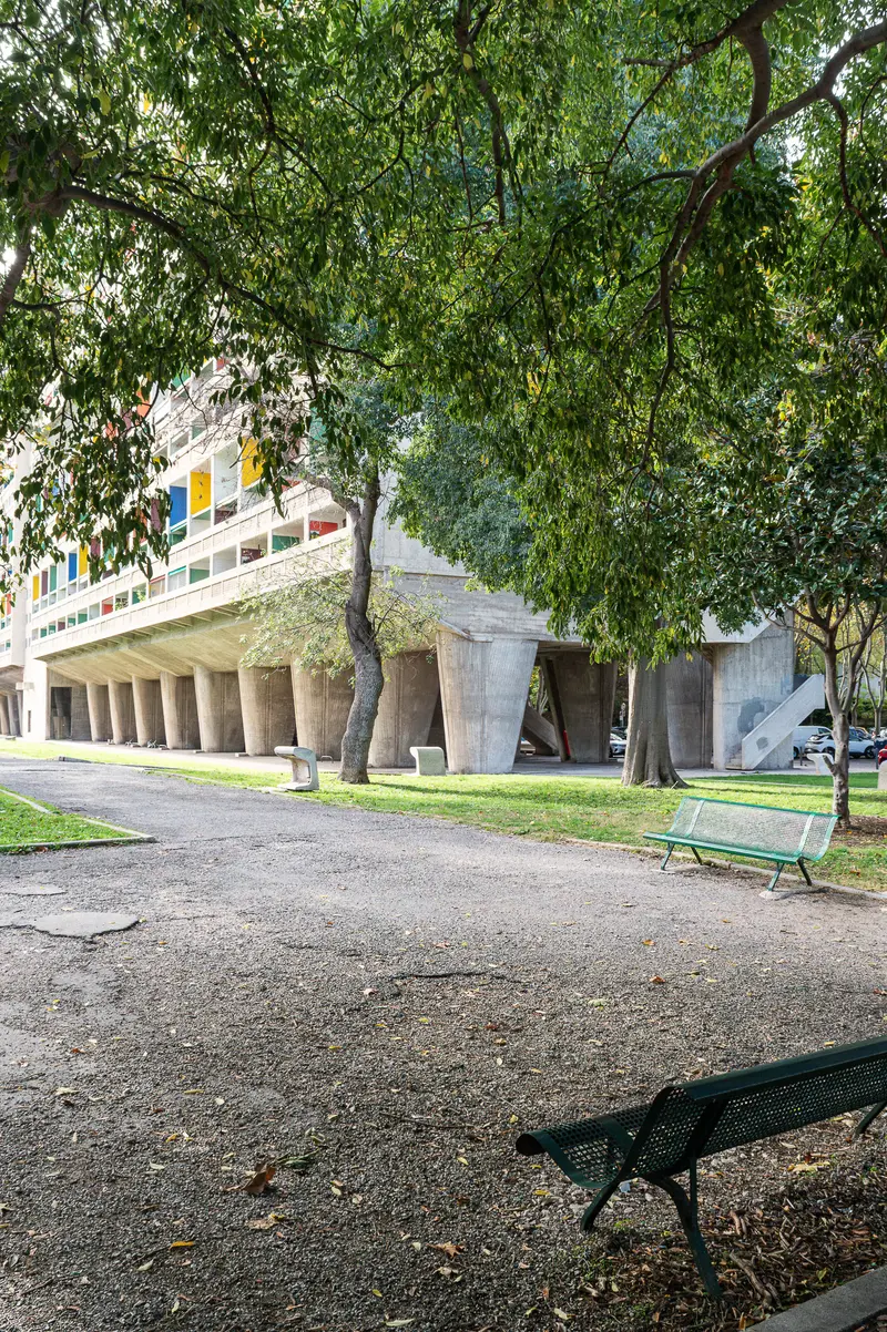 Modernist Concrete Architecture with Trees and Park Benches