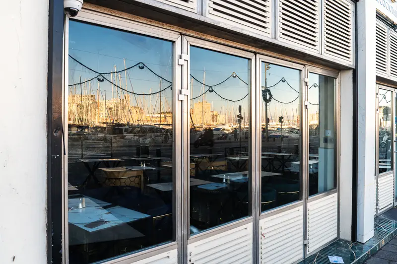 Sunset Reflections of Marseille Marina through Glass Windows