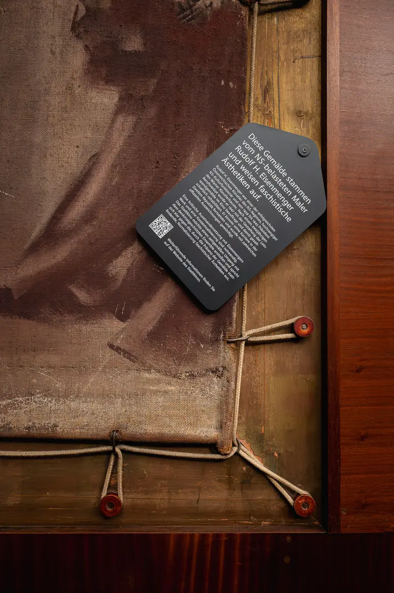 Detailed Exhibition Label on Weathered Wooden Frame and Textured Background