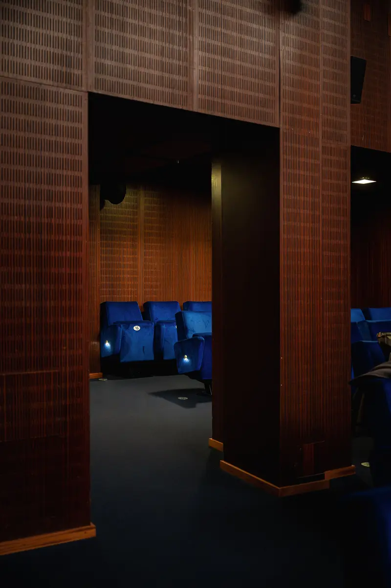 Architectural Interior at Stadtkino with Blue-Lit Technical Space