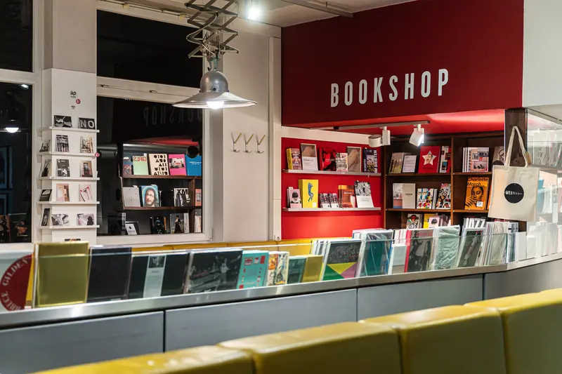 Westlicht Bookshop Interior Display with Red Wall and Featured Publications