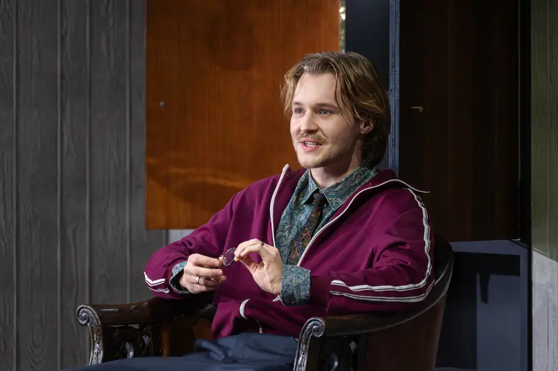 Actor in Purple Track Jacket at Kammerspiele der Josefstadt Vienna Production