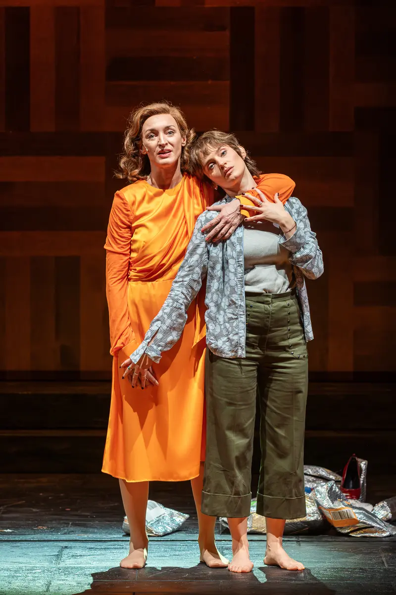 Two Actresses Embrace in Scene from Sophia at Theater in der Josefstadt