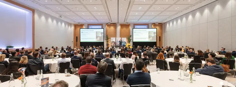 Controllertag 2026 Conference Hall with Attendees at Round Tables