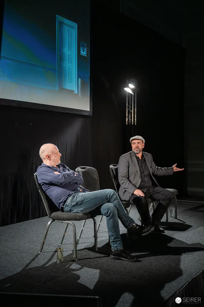 Two Men in Conversation at Controllertag 2026 Event
