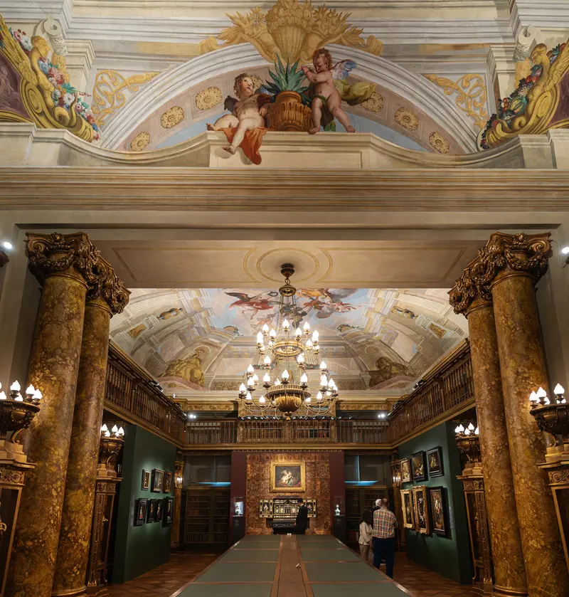 Ornate Palace Hall with Gilded Columns and Frescoed Ceiling