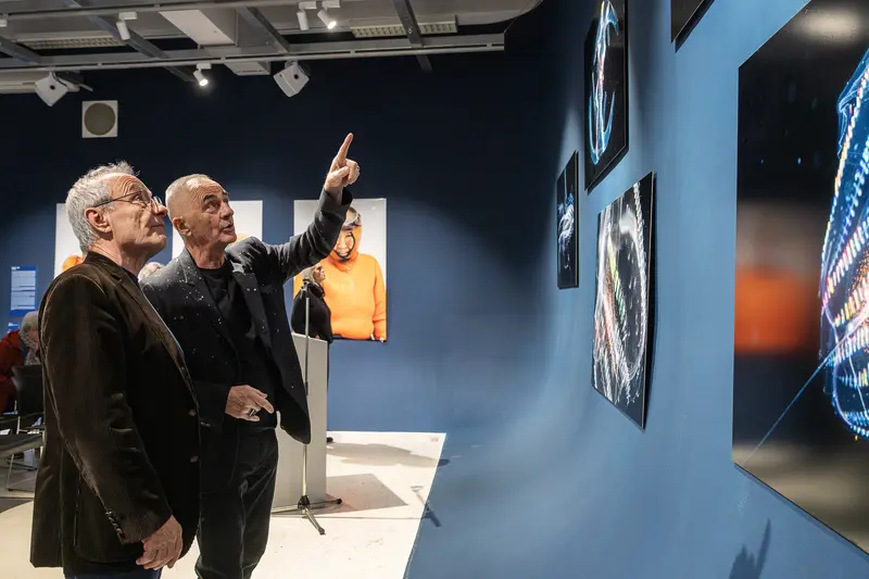 Michael Muller and Colleague Viewing Artwork at Contemporary Gallery Exhibition