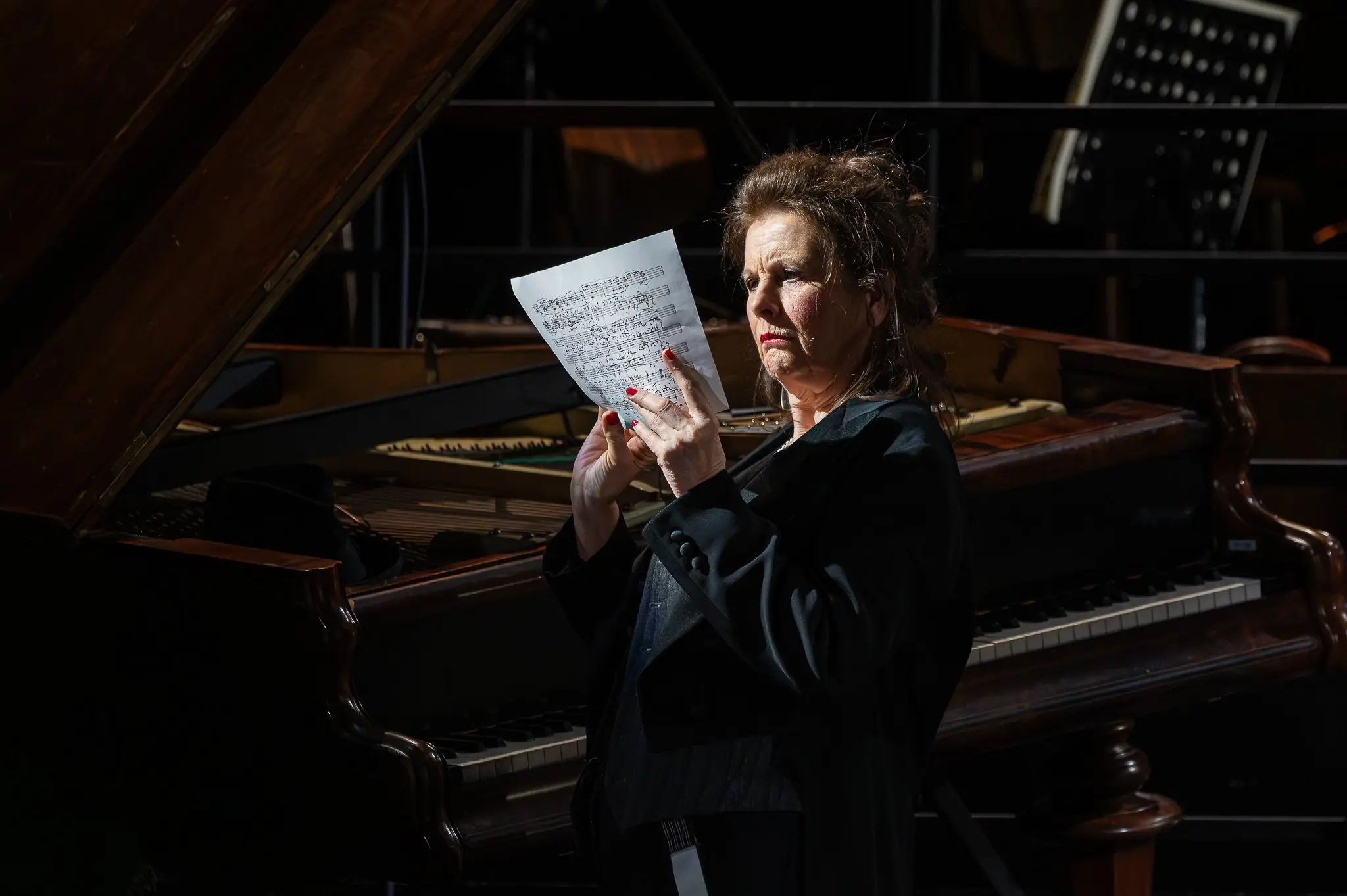 Susa Meyer Examines Musical Score at Zemlinsky Theater Rehearsal, Vienna 2026