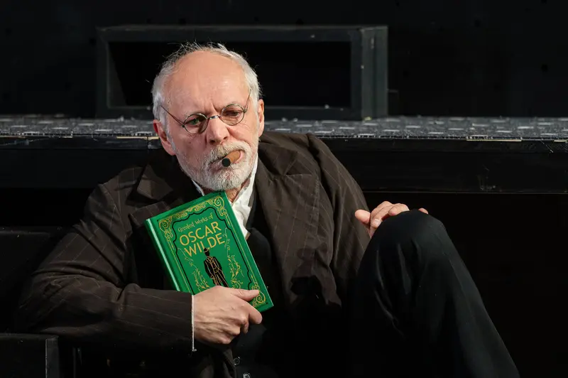 Actor Günter Franzmeier as Alexander Zemlinsky with Green Book, Theater in der Josefstadt