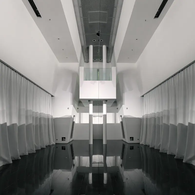 Symmetrical Interior View of Emma Hummerhielm Carlén's "By the wall" Exhibition at STRABAG ART Site