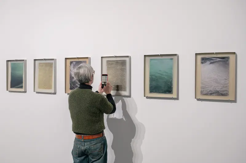Visitor Photographing Artworks at Emma Hummerhielm Carlén Exhibition at STRABAG ART Site