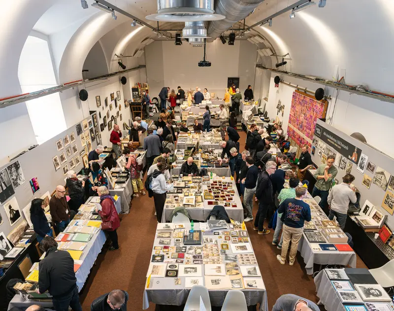 Book Fair in Cylindrical Gallery Space with Multiple Vendor Tables