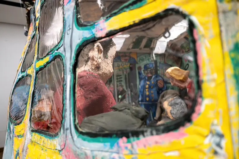 Detail of Painted Subway Car Sculpture with Papier-Mâché Passengers Inside