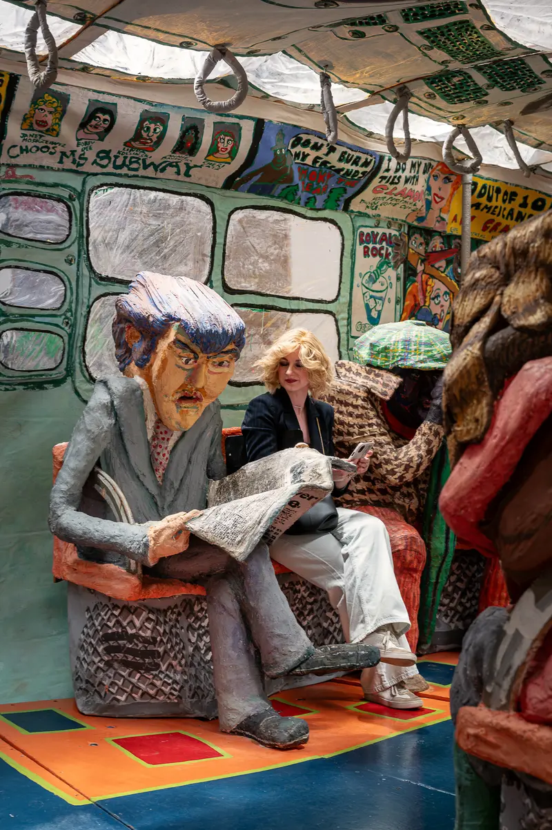 Papier-Mâché Passengers Inside Red Grooms' Ruckus Manhattan Subway Sculpture