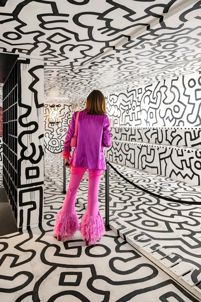Visitor in Keith Haring Installation at Albertina Modern Vienna Exhibition