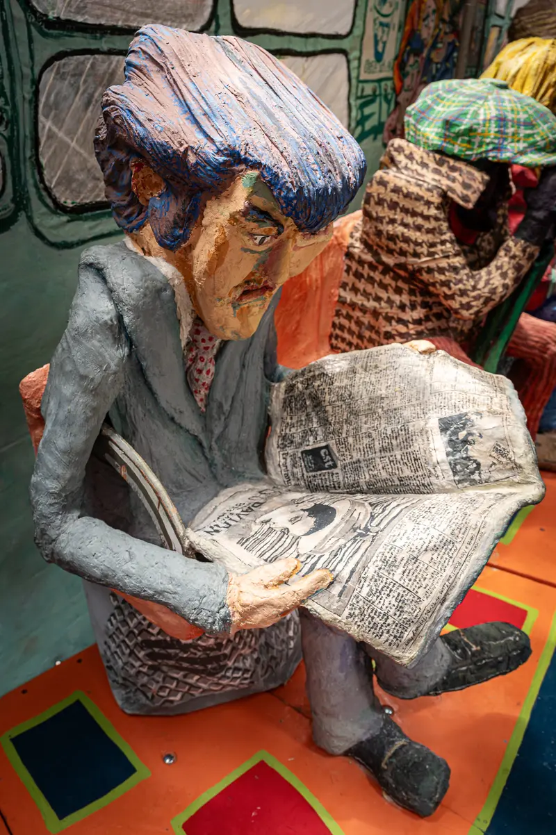 Papier-Mâché Passenger Reading Newspaper in Red Grooms Subway Sculpture