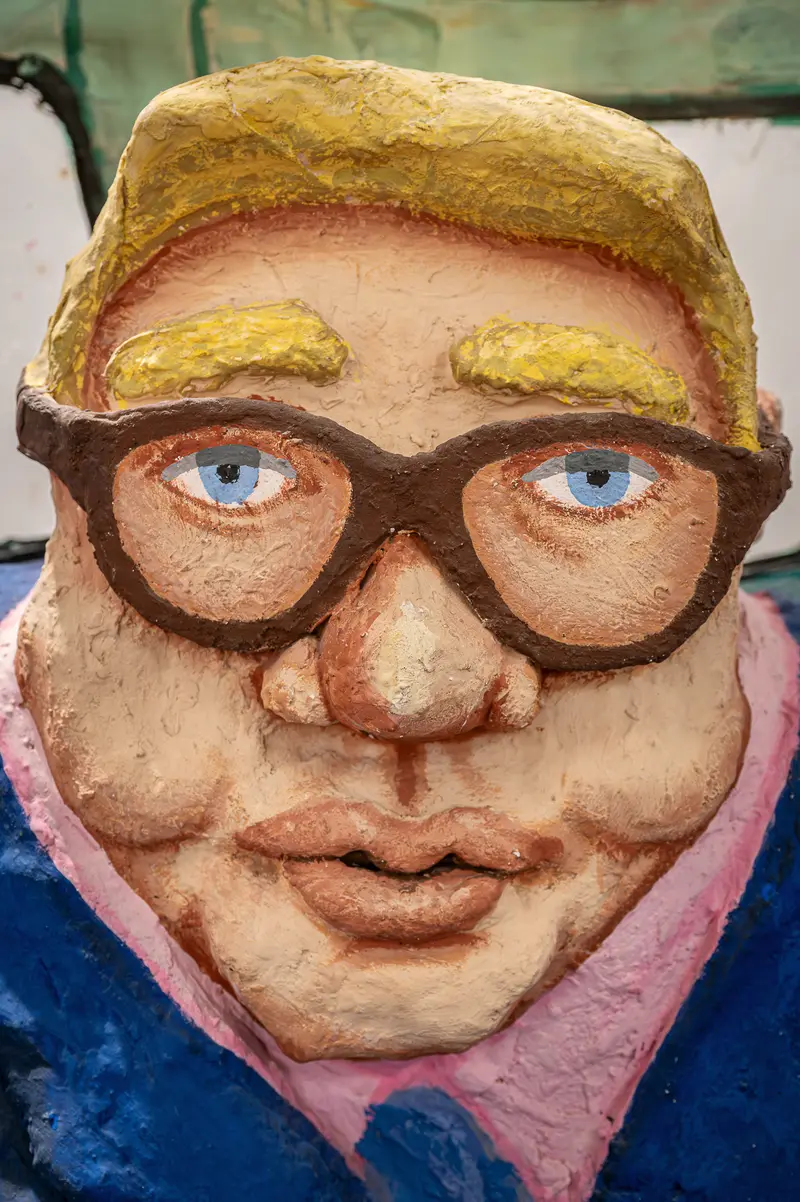 Papier-Mâché Passenger Figure with Glasses in Red Grooms Subway Sculpture
