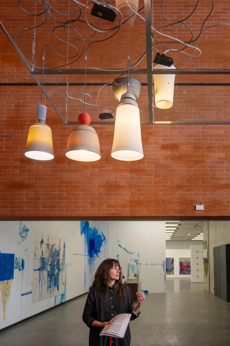 Woman Viewing Contemporary Art Installation in Gallery Space