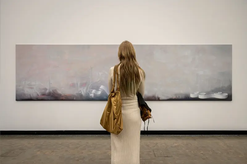 Visitor Observing Horizontal Landscape Painting at Kunsthalle Wien Exhibition