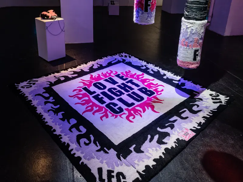 Interactive Floor Installation with Neon Typography and Purple Lighting