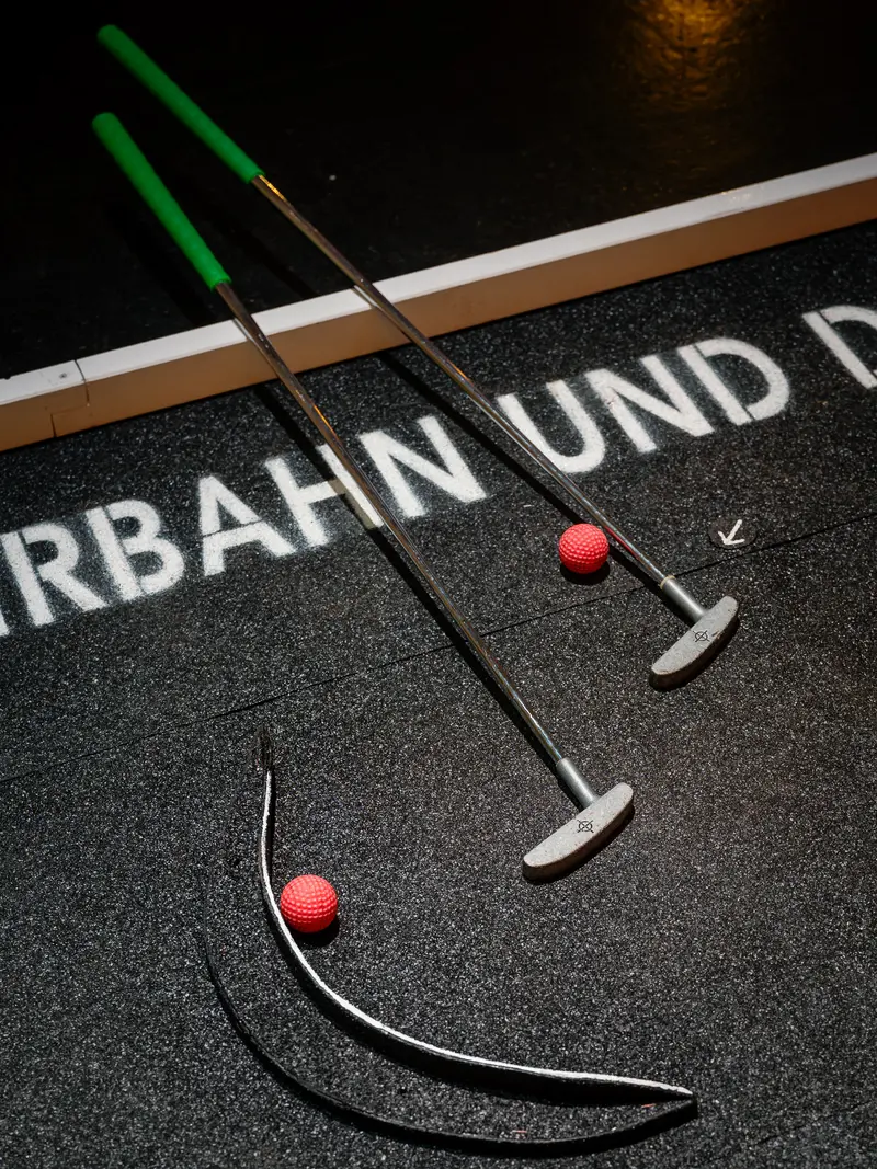 Miniature Golf Course with German Text and Red Balls
