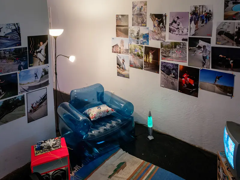 Personal Room with Blue Inflatable Chair and Wall-Mounted Photographs
