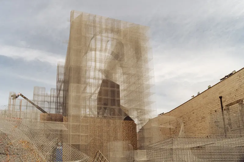 Sculptural Portrait Installation Behind Protective Mesh Netting