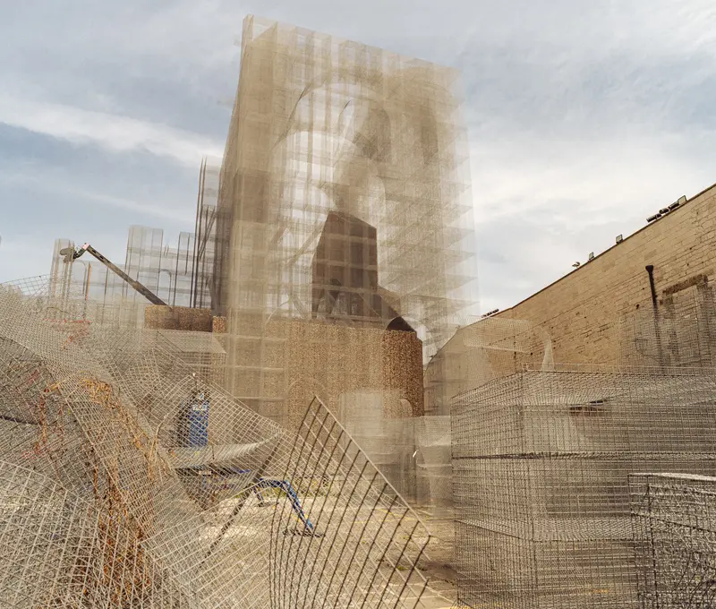 Construction Site with Transparent Portrait Overlay and Protective Fencing