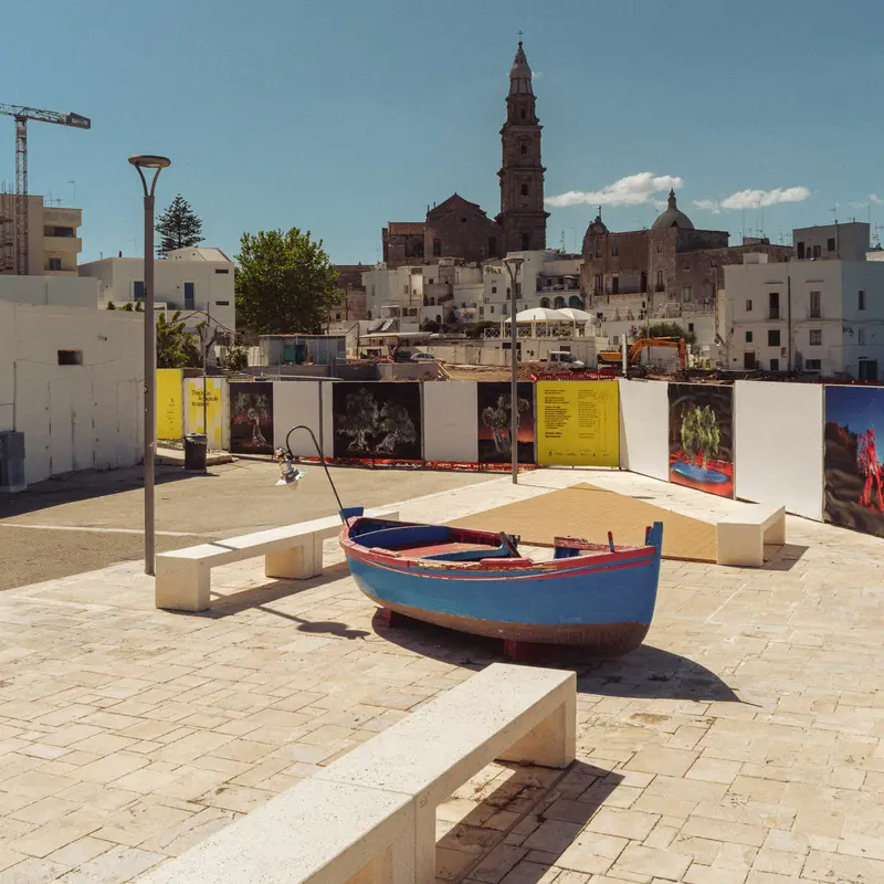 Fishing Boat Installation in Coastal Mediterranean Town Square