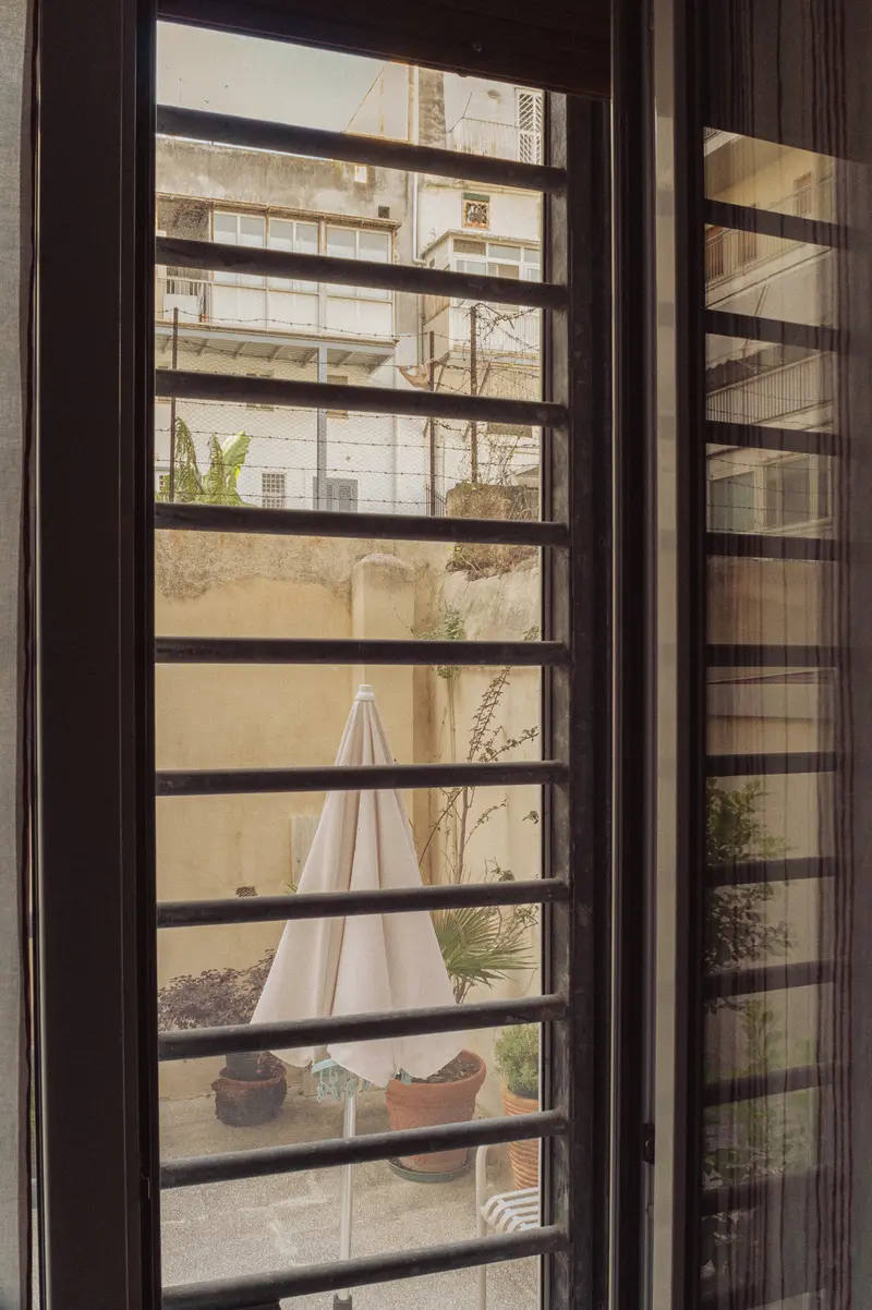 Horizontal Window Slats Framing Interior Apartment and Outdoor View