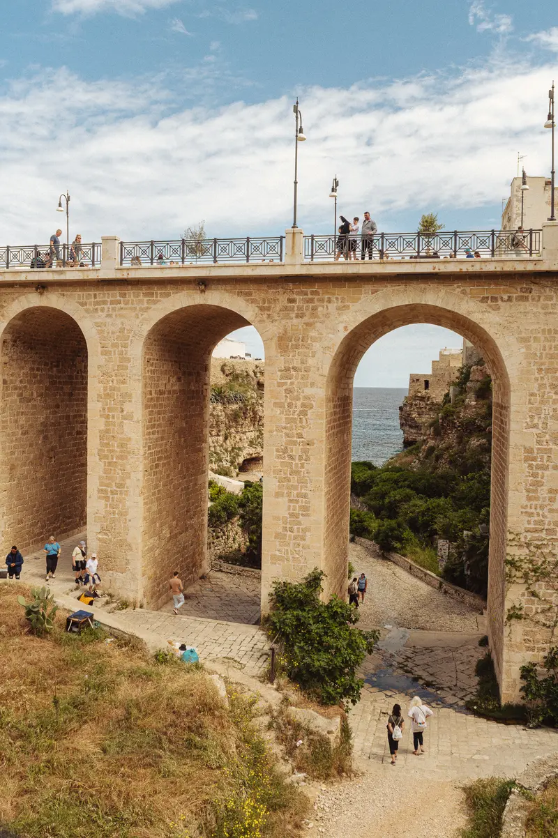 Roman Aqueduct Viaduct with Coastal Landscape and Visitor Access