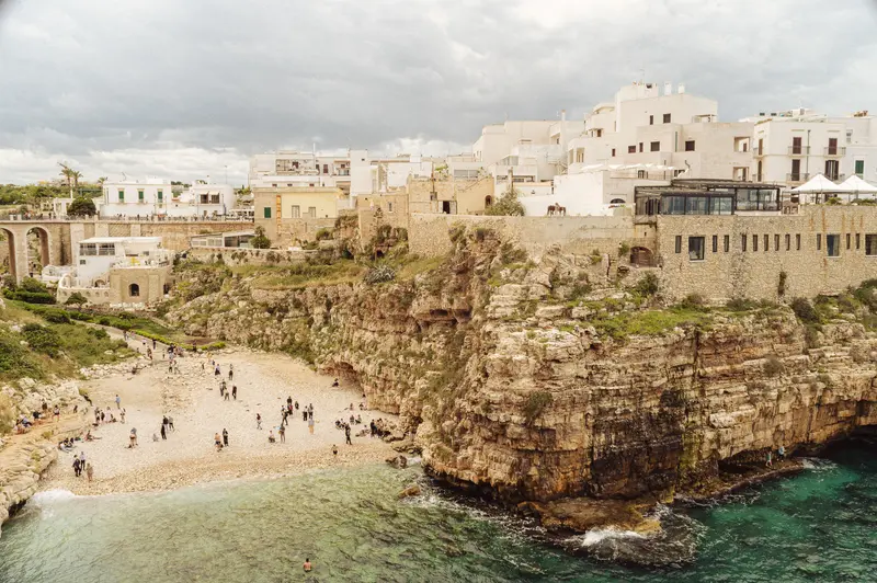 Polignano a Mare Coastal Town with Sandy Beach and Limestone Cliffs