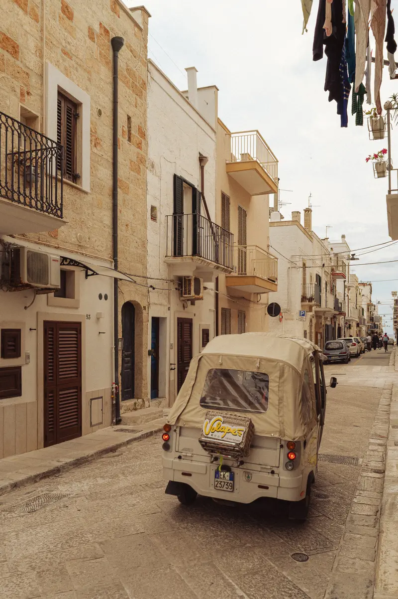 Cream-Colored Vespa Scooter on Narrow Mediterranean Street