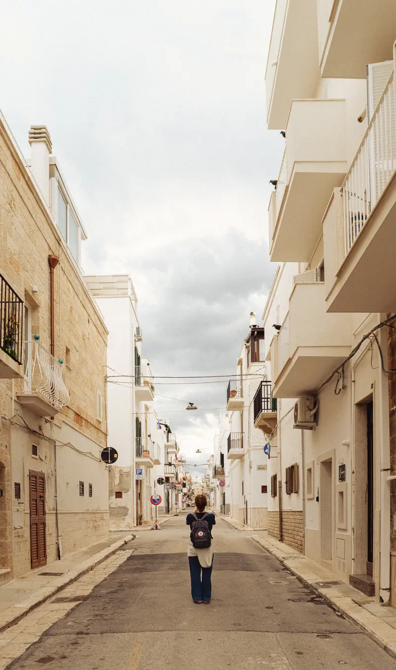 Pedestrian Walking Down Narrow Palestinian Street