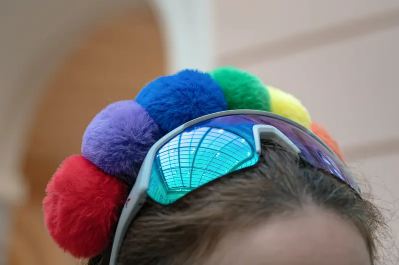 Colorful Pom-Pom Headband and Turquoise Sunglasses on Child