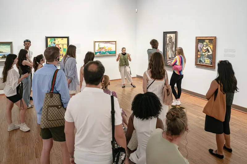 Museum Gallery Tour with Visitors Viewing Framed Artworks