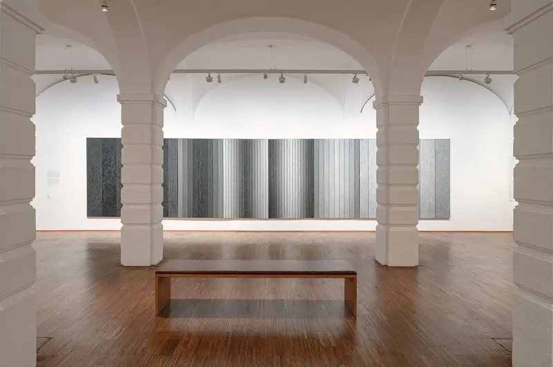 Contemporary Art Installation in Minimalist Gallery Space with Wooden Bench