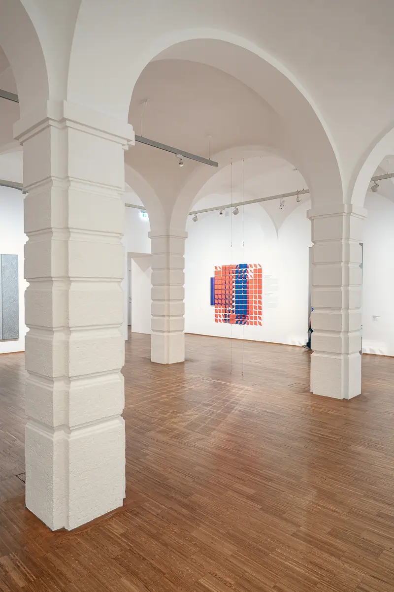 Contemporary Art Installation in Modernist Gallery Space with Arched Ceiling